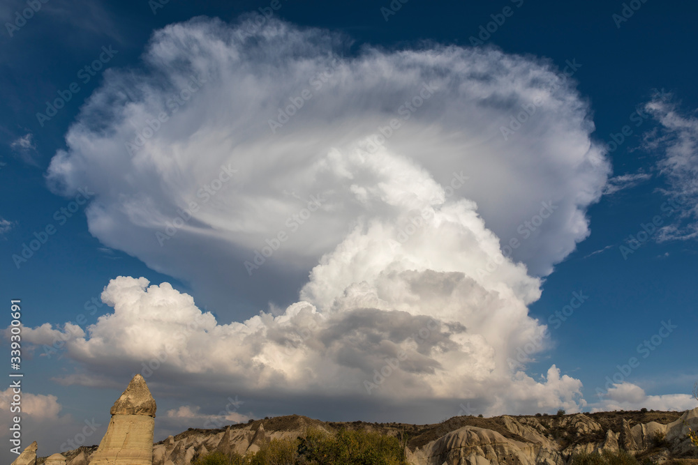 White interesting clouds over Cappadocia Valley, Nevsehir, Turkey.