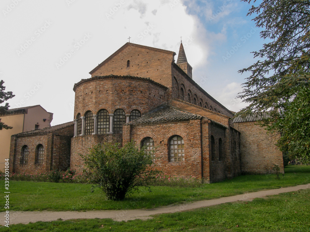 An old red brick Church with straight lines of architecture and Windows in small opaque squares