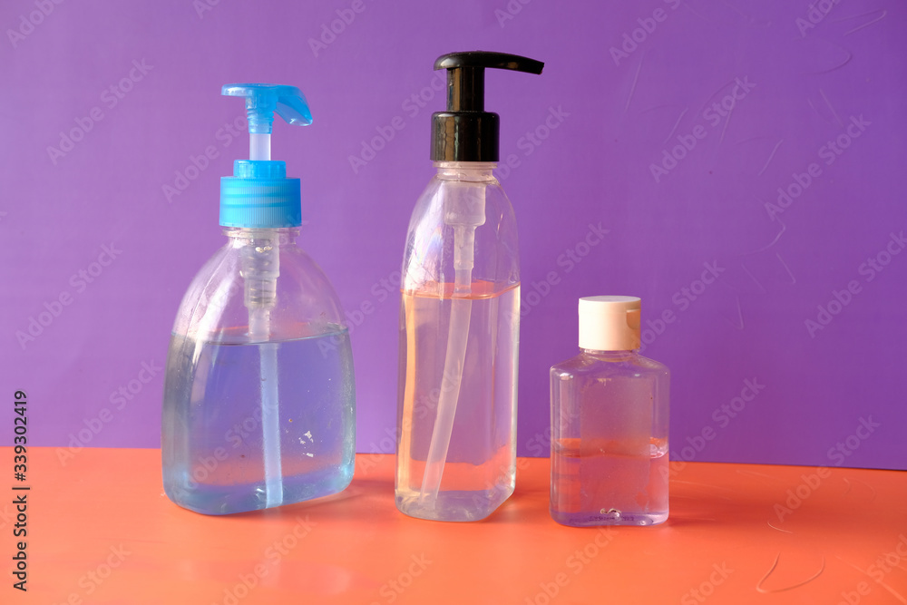 hand sanitizer and liquid soap on color background hand sanitizer and liquid soap on color background