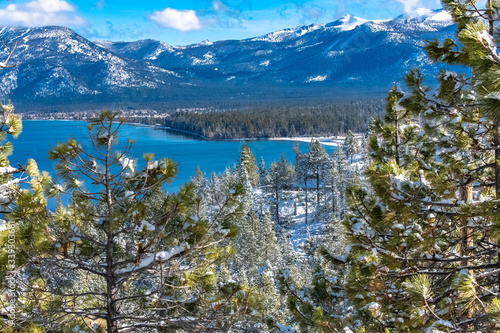 The Lake Tahoe, panorama of a mountain lake in winter, sunny day 