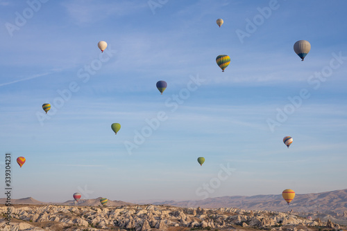 A lot of hot air balloons in the blue sky in Goreme Cappadocia. Beautifull background texture. Hot air ballons.