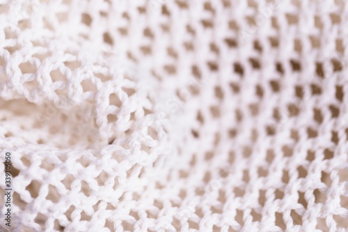 White fabric mesh textile background  knitting background texture