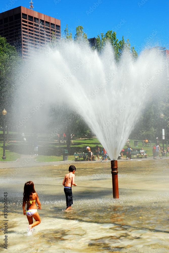 Children cool off on a hot day in Boston Common