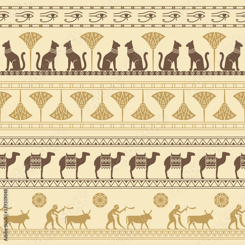 A seamless pattern based on the symbols of ancient Egypt. Cats, lotus flowers, camels, buffaloes and more