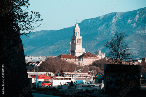 Saint Dominus belltower in Split,Croatia seen from a different angle, train tracks and ugly abandoned area in the foreground.