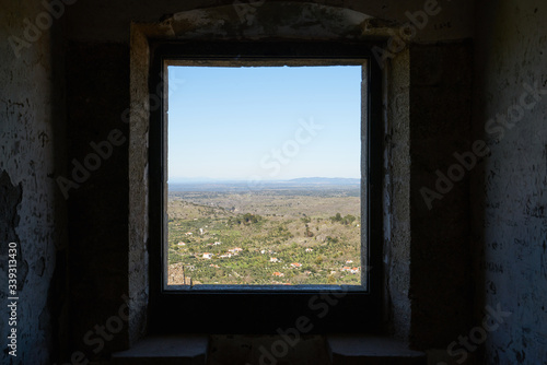 View of Castelo de Video Serra de Sao Mamede mountains landscape through the window of the castle, in Portugal