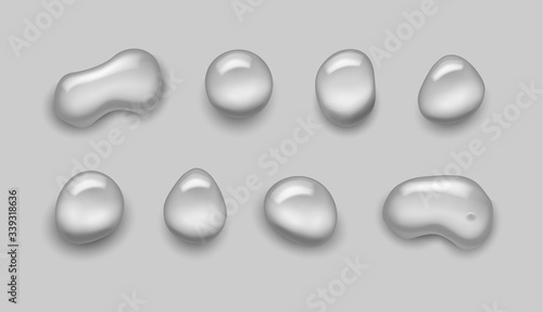 Vector shiny realistic transparent water drops collection on checkered background