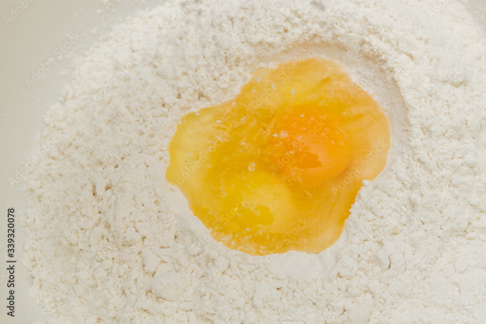 Cooking dough in a white plastic bowl at home Cooking dough in a white plastic bowl at home