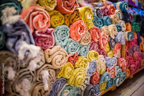 folded rolls of towels bed linen Galata Turkish Bazaar fabric © Yulia