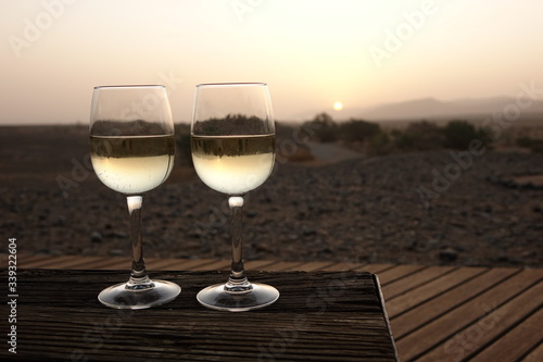 SUNSET APERITIF WITH TWO GLASSES OF WHITE WINE