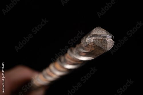 Construction sintered carbide drills damaged. Worn out tools for builders.