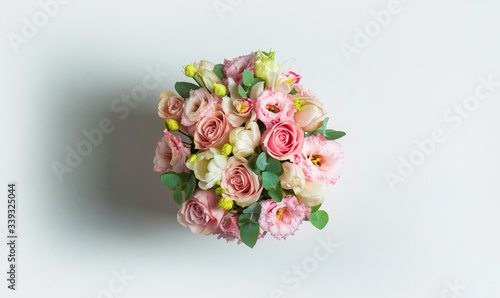 Original flower bouquet. Multi-colored bouquet of flowers. Colorful flower bouquet from roses isolated on white background. Fresh, lush bouquet of colorful flowers, isolated on white background