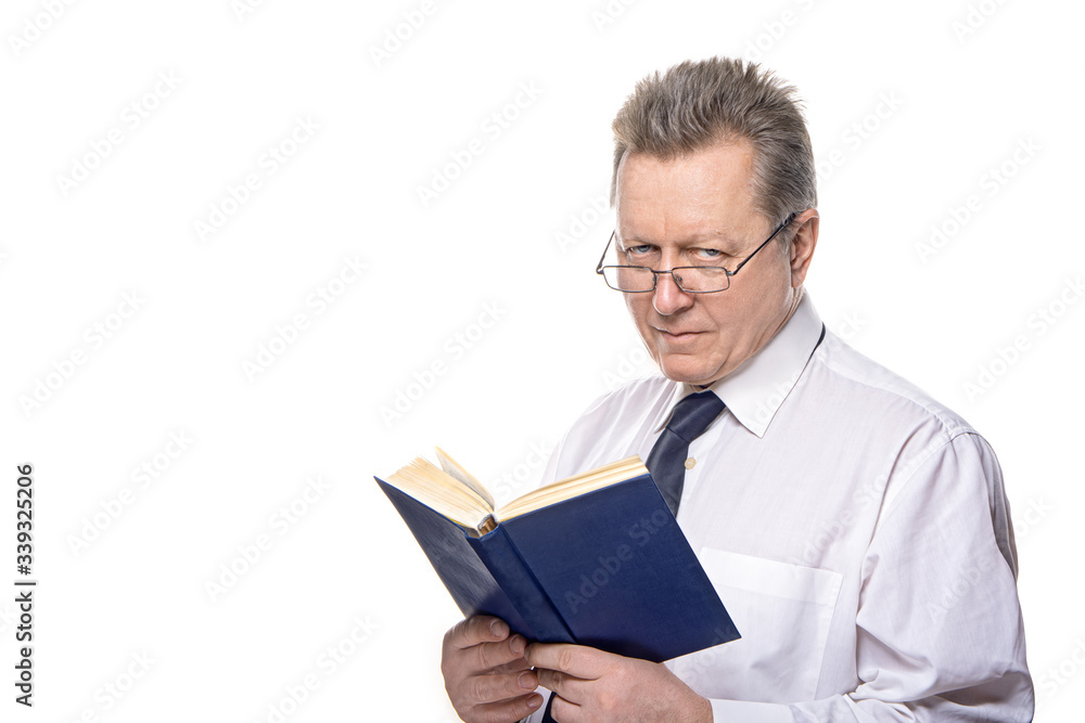Closeup portrait of senior elderly teacher with glasses holding book, isolated on white background. Education concept Closeup portrait of senior elderly teacher with glasses holding book, isolated on white background. Education concept