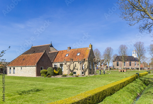 Historic farm and church in small town Sondel, Netherlands