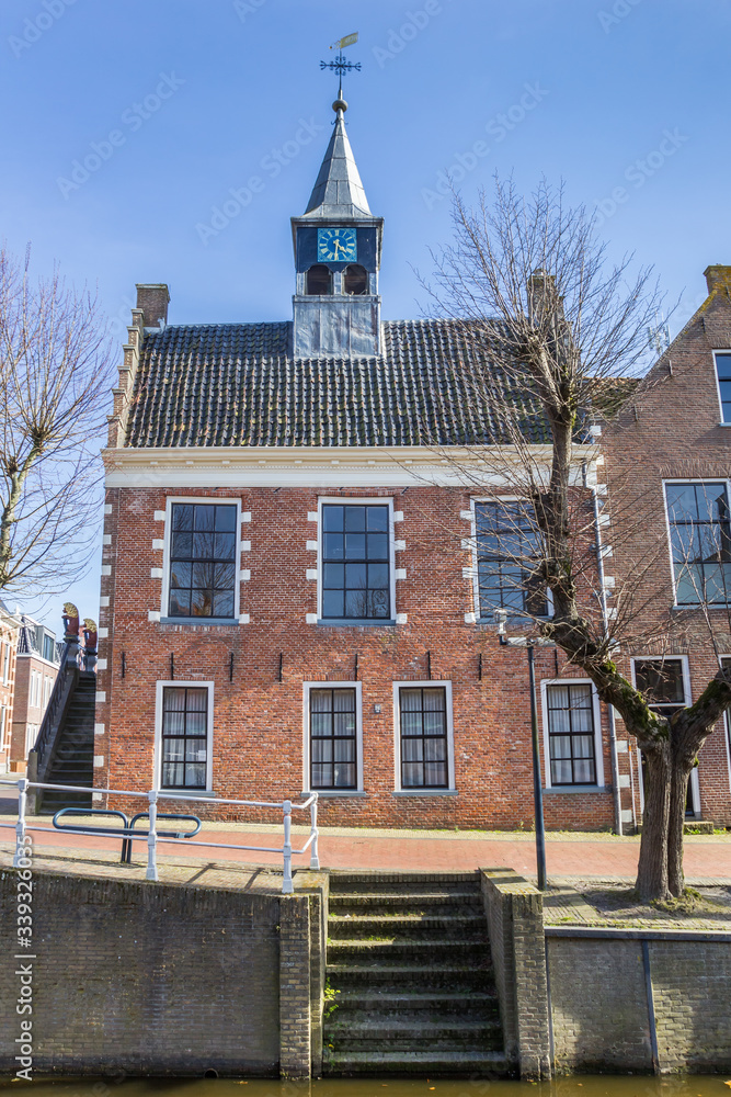 Historic town hall at the canal in Balk, Netherlands