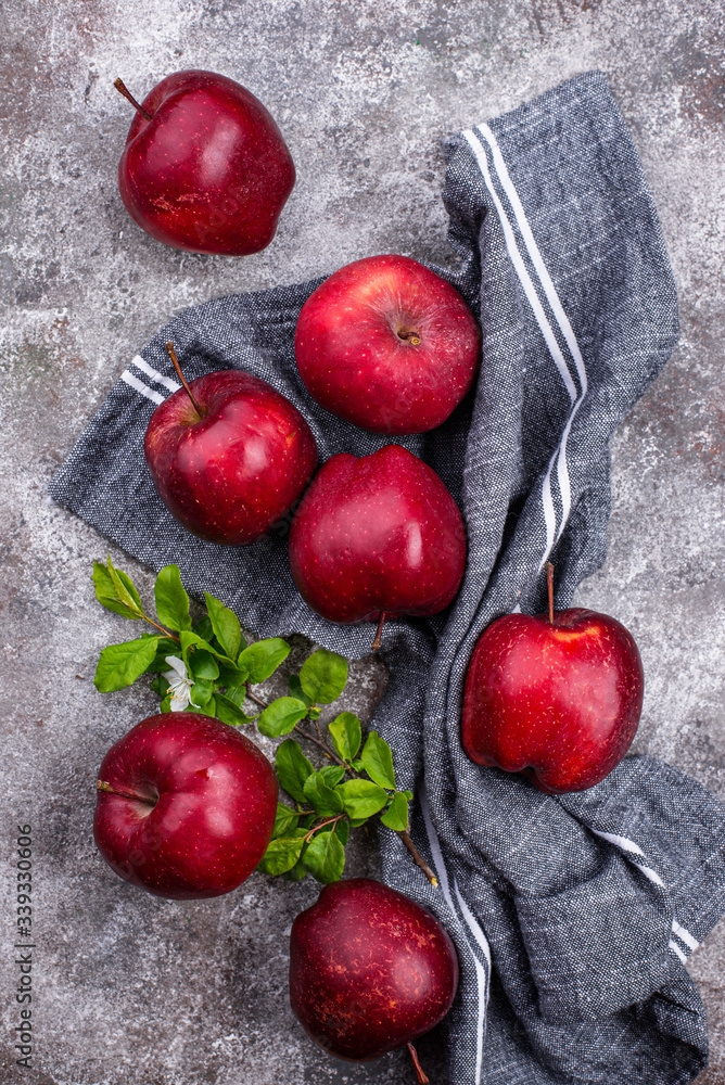 Fresh red ripe apples on gray background Fresh red ripe apples on gray background