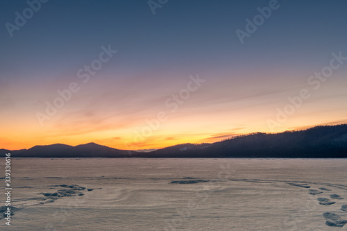 Sunrise above Baikal Lake in Russia © evdokimari