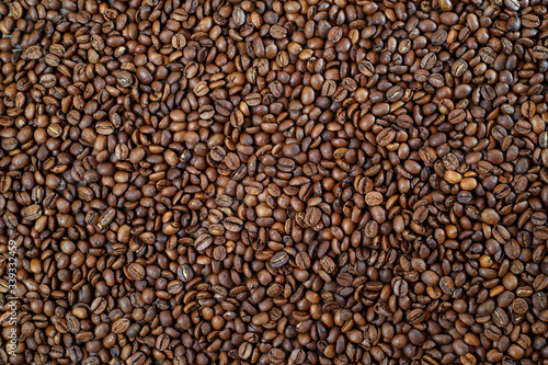 Aromatic roasted coffee beans on the table