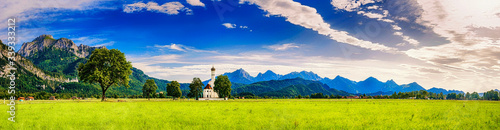 Sommer im Schwangau mit Sankt Coloman und Neuschwanstein vor den Alpen, Bayern, Deutschland photo