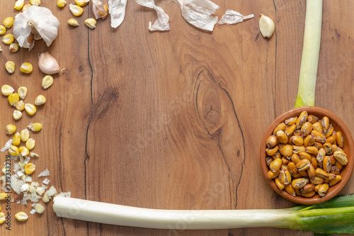 FRIED CORN WITH INGREDIENTS FOR ITS PREPARATION. TYPICAL KITCHEN OF ECUADOR CALLED TOSTADO.