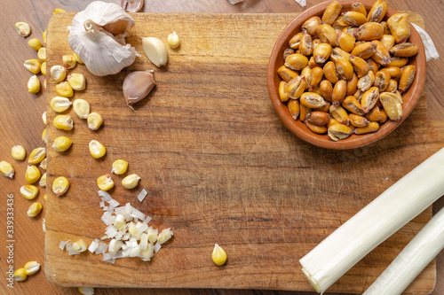 FRIED CORN WITH INGREDIENTS FOR ITS PREPARATION. TYPICAL KITCHEN OF ECUADOR CALLED TOSTADO.