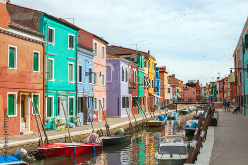 Boats on the canal of Burano island (Venice) in summer