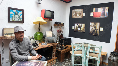 Obraz na płótnie Young man with hat next to crafts and antiques in Salento Quindio Colombia w salonie