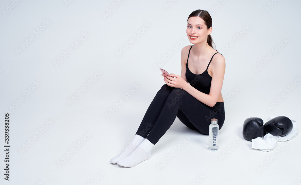 Young woman after boxing workout on a white background. Young woman after boxing workout on a white background.