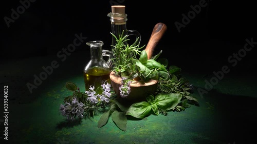 Homegrown and aromatic herbs on rustic background with rosemary and basil in 4K photo