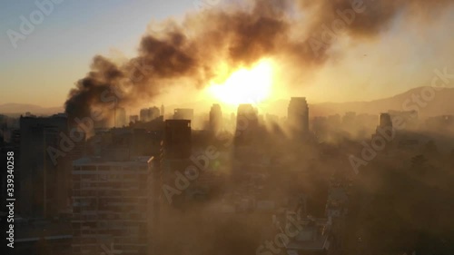 Aerial shot of drone from Plaza Baquedano towards the center of Santiago in a fireDrone shot of the day after the fire at the Pedro de Valdivia University near Plaza Baquedano photo