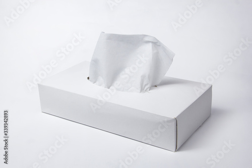 Napkins in a box on a white background. Box for napkins. Natural material.