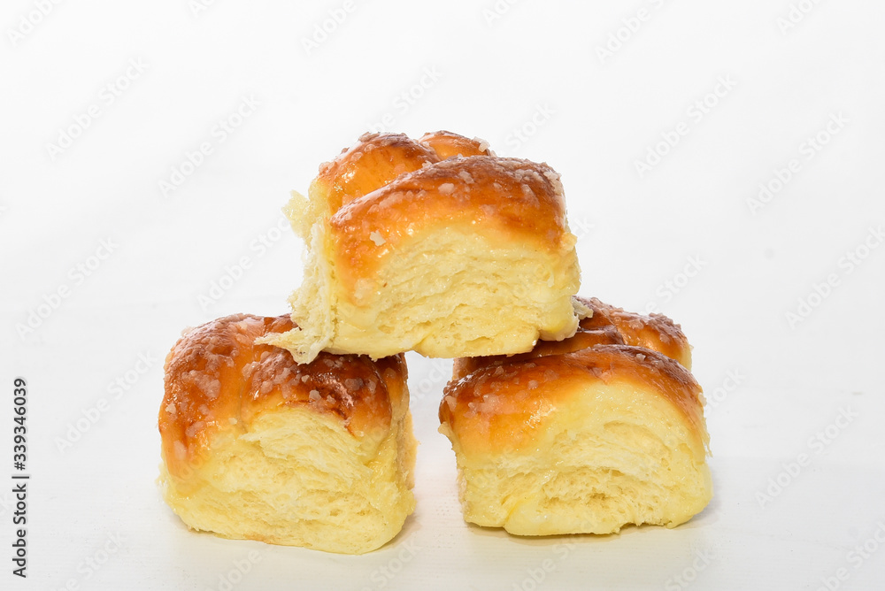 Sweet bread, typical of the Brazilian bakery, on the table on white background with space for text. It has the name of Rosca.