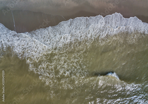Waves breaking on the shores of a warm sunny beach in South Carolina
