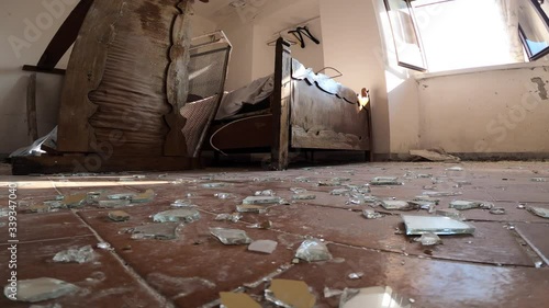 Broken glasses on the floor after a housebreaking in a abandoned house. 4k