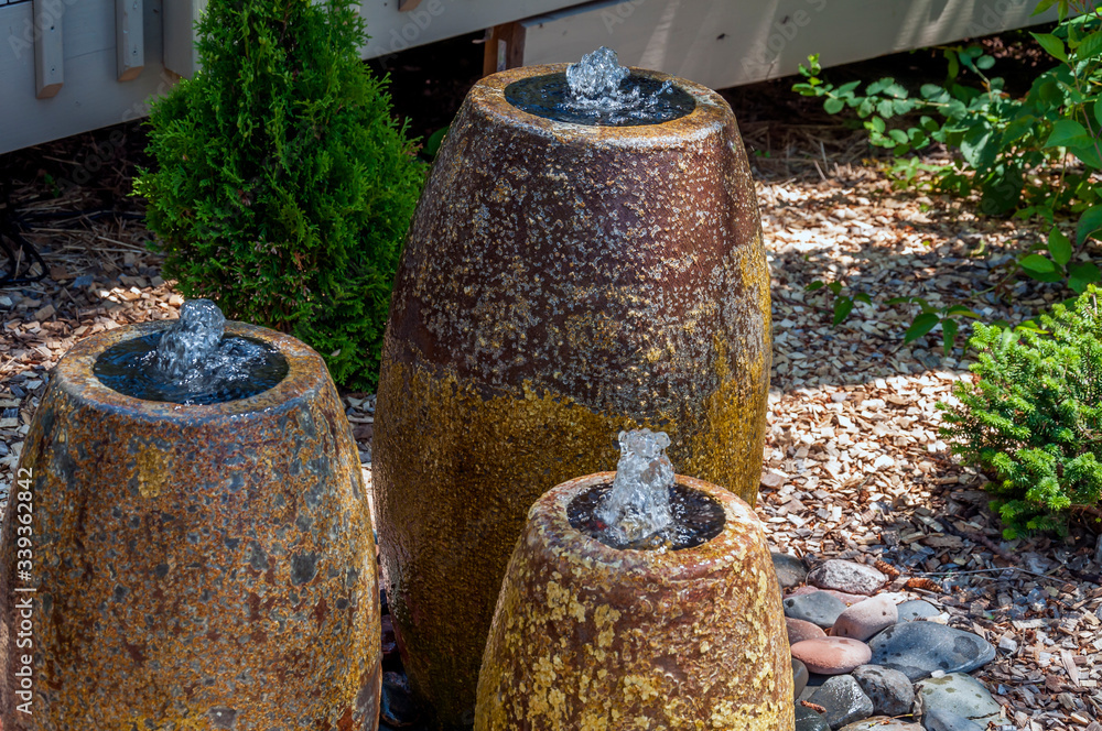 three fountains spurting water