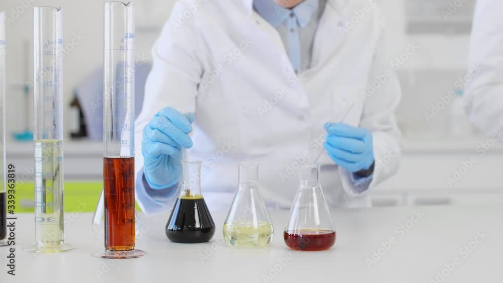 Close up of scientists working with CBD oil