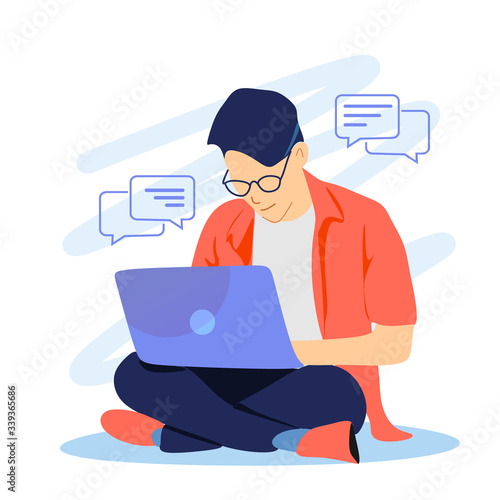 Young businessman enjoying working from home looking at the laptop