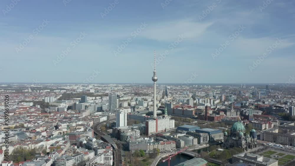 AERIAL: Wide View of Empty Berlin, Germany Alexanderplatz TV Tower with almost No People or Cars on Beautiful Sunny Day During COVID19 Corona Virus Pandemic AERIAL: Wide View of Empty Berlin, Germany Alexanderplatz TV Tower with almost No People or Cars on Beautiful Sunny Day During COVID19 Corona Virus Pandemic
