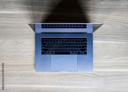 overhead view of apple MacBook laptop on desk