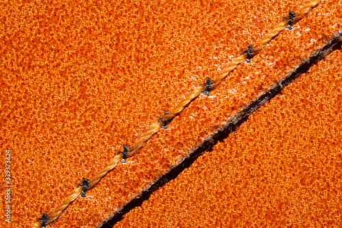 Brown leather texture with a linear stitch