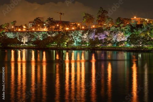 Kangaroo point cliffs Brisbane a climbing and tourist destination at night with water reflections in the Brisbane river