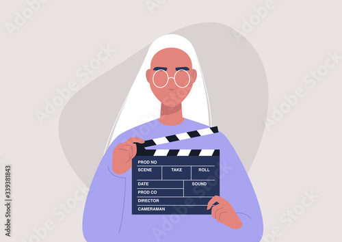Movie production, young female character holding a clapper board, video industry