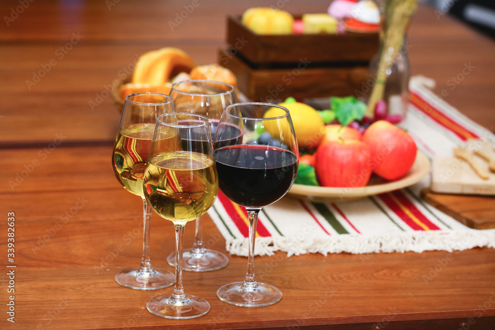 variety fruit with white and red wine on reception desk variety fruit with white and red wine on reception desk