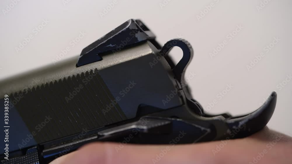 a shot of an airsoft pistol is released and the hammer is released a shot of an airsoft pistol is released and the hammer is released