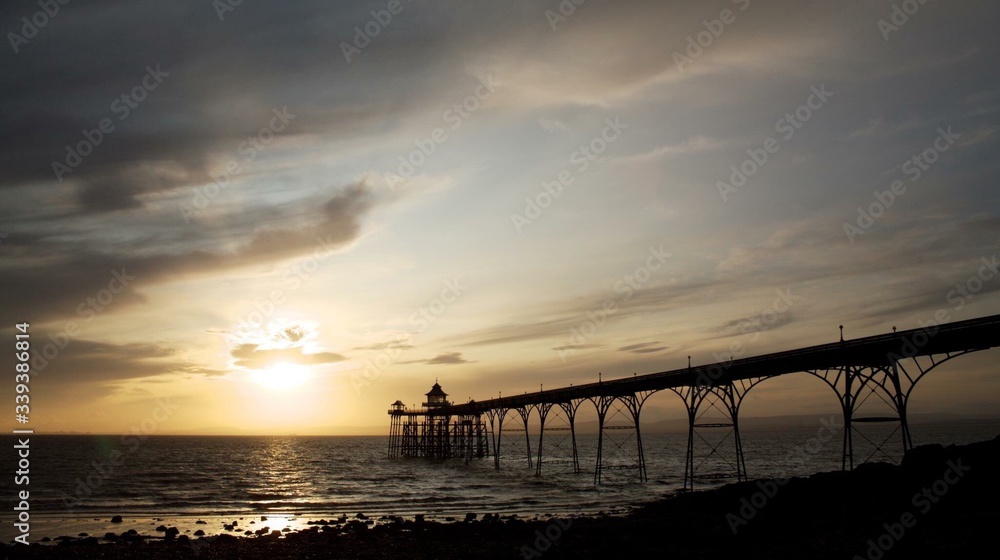 Silhouette Clevedon Pier Over Sea Against Sky At Sunset