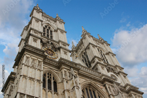 Western facade of Westminster Abbey with Gothic style in a sunny day, London, UK