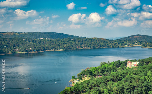Fototapeta Naklejka Na Ścianę i Meble -  lake serene blue water with misty mountains aerial image