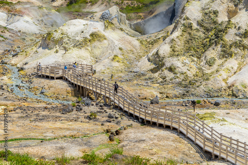 Natural Landscape of Jigokudani valley or hell valley with wooden pathway for sightseeing in summer. An active volcano in Noboribetsu, Hokkaido, North of Japan.