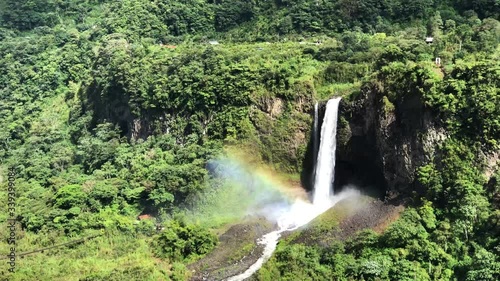 Close up shot of Manto de la Novia waterfall with rainbow in Ecuador. Amazing waterfall in the course of the Pastaza river near to Baños de Agua Santa.