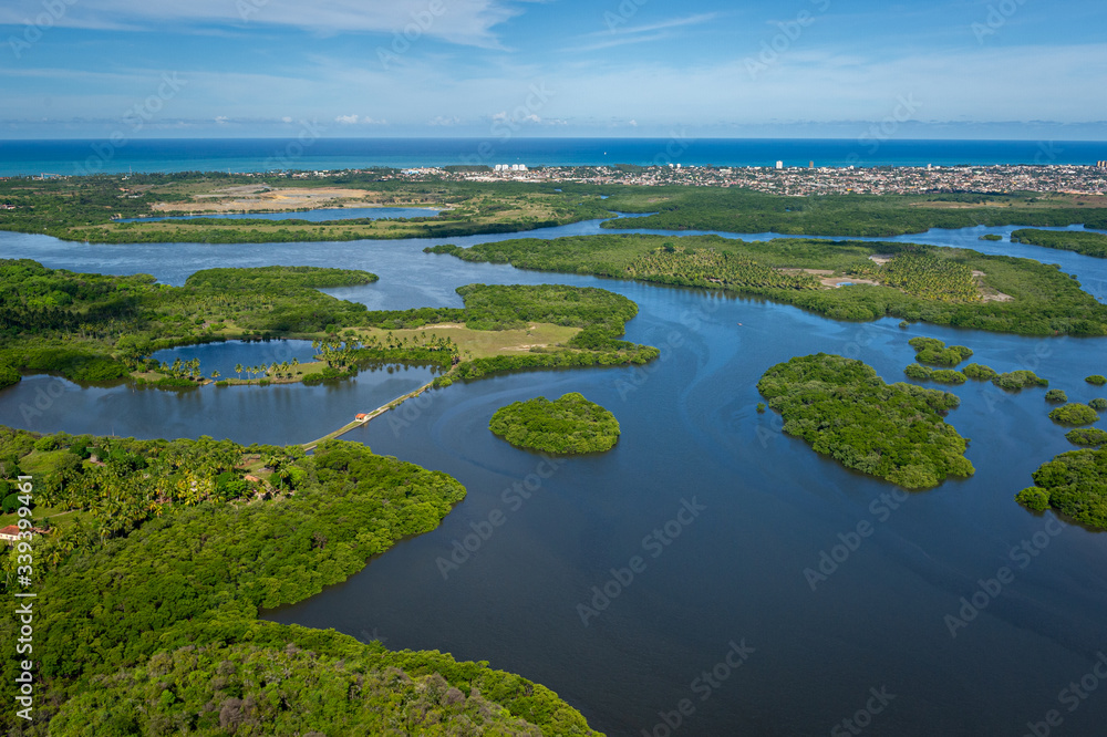 Canal de Santa Cruz, south of the island of Itamaraca, near Recife, Pernambuco, Brazil on March 1, 2014. Forests, mangroves and coconut trees between the river, forming small islands. Aerial view